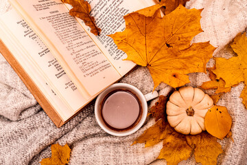 Autumn composition book, cup of coffee, pumpkin and leaves