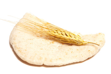 Pita bread with wheat ears isolated on white background. National cuisine. Healthy eating. Vegetarian food.