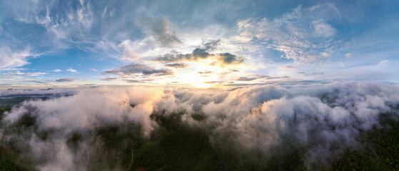 Aerial view Beautiful  panorama of morning scenery Golden light sunrise And the mist flows on high mountains forest. Pang Puai, Mae Moh, Lampang, Thailand. - obrazy, fototapety, plakaty