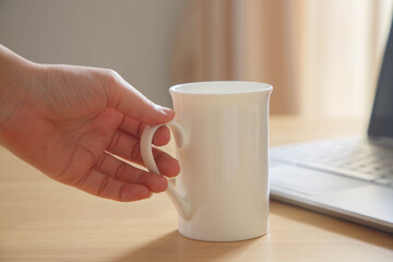 Morning coffee on the table with computer laptop for working day