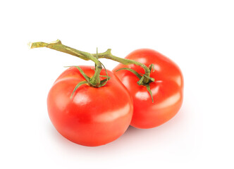 two tomatoes with a sprig