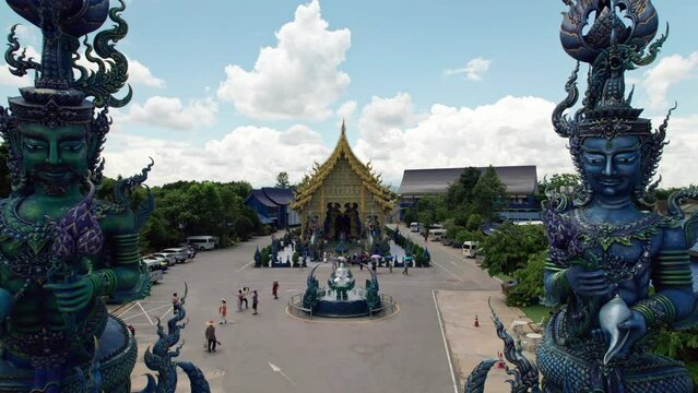 Aerial drone footage of the blue temple in Chiang Rai. Buddha religion temple architecture. Asian temple.