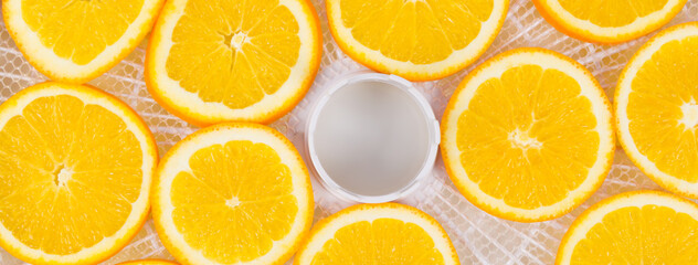 on a white round grate, sliced orange fruit,..for further drying, close-up