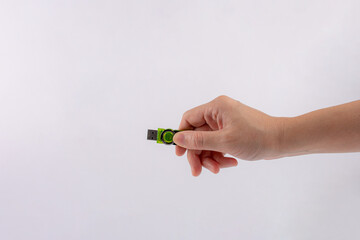 Flash drive in hand isolated on white background