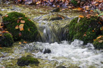 Fototapeta na wymiar Photo of water flowing in a river during autumn
