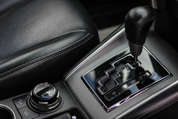 automatic transmission shift selector in the car interior. Closeup a manual shift of modern car gear shifter. 4x4 gear shift	