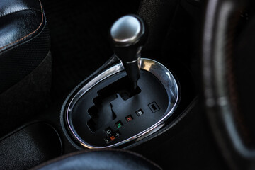 automatic transmission shift selector in the car interior. Closeup a manual shift of modern car...