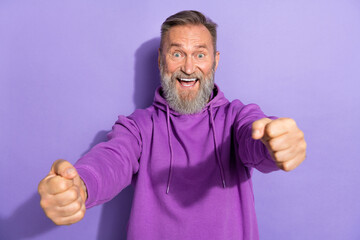 Photo of handsome retired impressed ecstatic man white gray beard purple hoodie imagine he in...