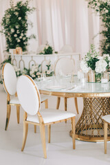 Wedding banquet white decorated with flowers
