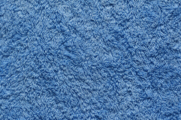 Extreme close-up blue fluffy shaggy bathroom towel flat filling the frame 