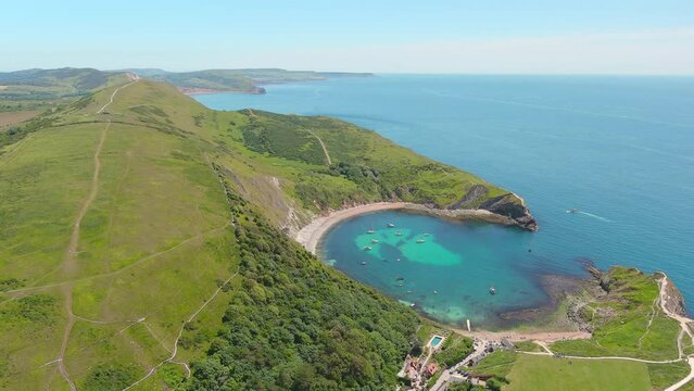 Lulworth Cove, UK: Aerial view of picturesque cove on Jurassic Coast - landscape panorama of United Kingdom from above
