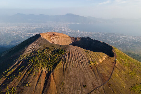 Aerial view of Mount Vesuvius crater at sunset, a volcano in Naples, Campania, Italy.