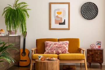 Vintage and cozy space of dining room with mock up poster frame, yellow sofa, wooden coffee table, guitar, plants, commode, decoration and personal accessories. Stylish home decor. Template.	