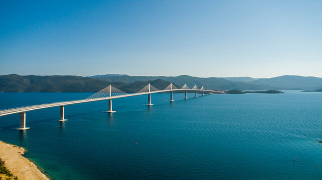 Aerial view of Peljeski bridge, a suspended railroad and highway crossing the Bay of Mali Ston in Croatia.