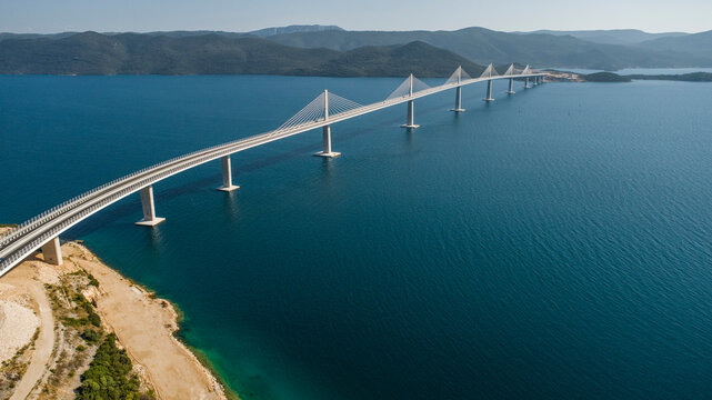 Aerial view of Peljeski bridge, a suspended railroad and highway crossing the Bay of Mali Ston in Croatia.