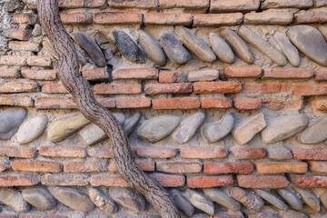 stone background, vintage. Wall of an old house made of stones and bricks