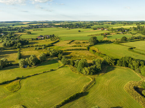 Aerial view of small river meandering Geul and grassland in valley Geuldal, Mechelen, Zuid Limburg, Netherlands.
