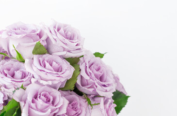 a bouquet of delicate purple roses with a copy of the space
