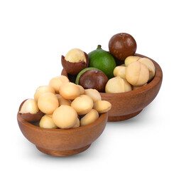 Macadamia nuts in wooden bowl isolated on white background.
