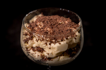 Dessert with chocolate on top of the glass.