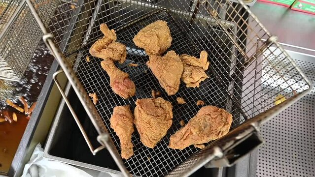 Broasted Chicken Taken out from Frying Machine, fried chicken the most popular fast food