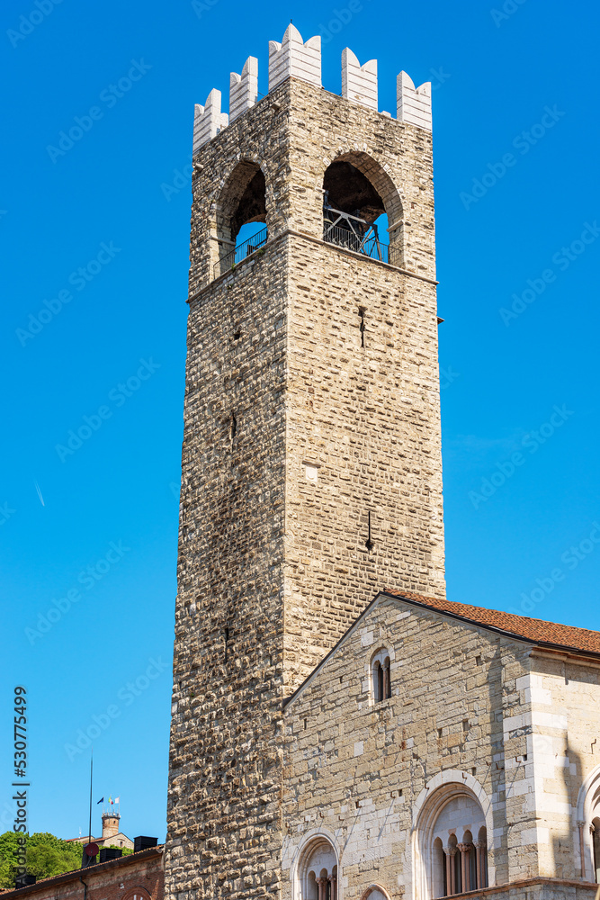 Wall mural Brescia. Medieval tower (Torre del Popolo o del Pegol) and the Broletto Palace (Palazzo Broletto), XII-XXI century, Town square called Piazza Paolo VI, Lombardy, Italy, Southern Europe.