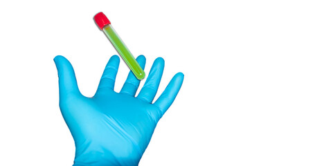 Hand with latex surgical glove holds sealed test tube with green liquid on white background. medical advertising concept