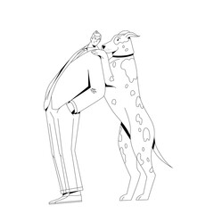 A man in a suit stands with a dog.