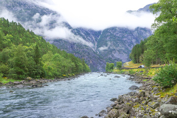 Low hanging clouds in Eidfjord on river Eio, Norway