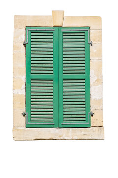 Old wooden window with closed green attice shutters. Vertical. Isolated on a white background.