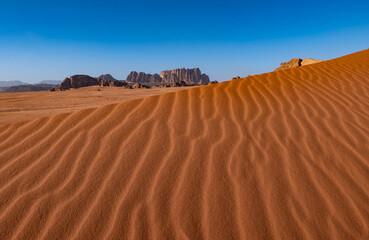 Dunes and patterns in the sand in the Wadi Rum desert, sunny day, Jordan