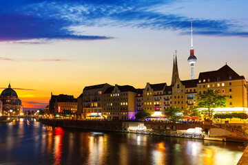 River Spree and the downtown buildings of Berlin, evening lights view, Germany