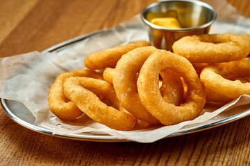 An appetizer for beer - onion rings fries. Close-up, selective focus