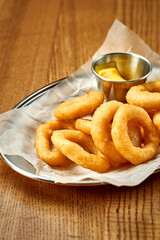 An appetizer for beer - onion rings fries. Close-up, selective focus