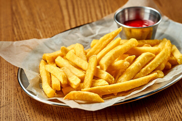 An appetizer - French fries with sauce. Close-up, selective focus