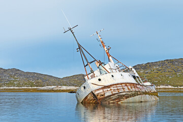 The wreck of the fishing boat Narhval, abandoned near the town of Paamiut in southern Greenland. - Powered by Adobe