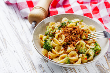 orequette pasta with broccoli on a white background