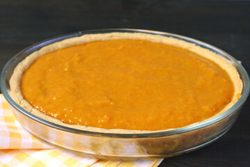 Pie crust filled with mixture ready for baking pumpkin pie