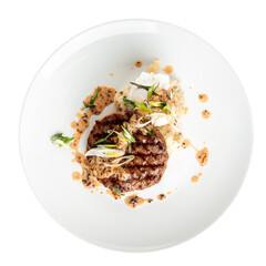 Plate of gourmet grilled beef cutlet with sauce