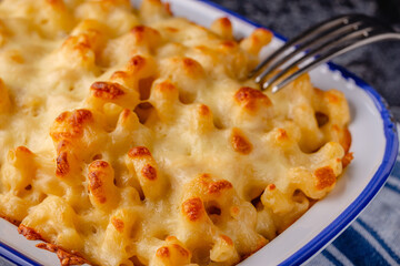 American mac and cheese, macaroni pasta in cheesy sauce