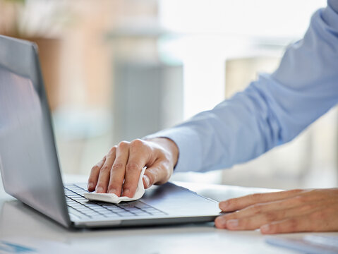 Businessman, Laptop And Covid Sanitizer Wipe For Cleaning Keyboard Bacteria, Virus Or Stop To Global Healthcare Crisis. Zoom On Worker Hands, Security Or Employee Safety Compliance In Company Office