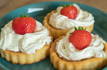 A beautiful dessert of sponge cake and cream with strawberries