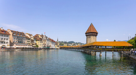 LUCERNE, SWITZERLAND, JUNE 21, 2022 - View of the wodden covered Kapellbr&uuml;cke Bridge on the Reuss river in Lucerne, Switzerland