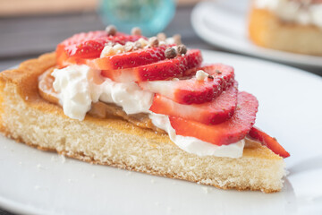 A beautiful dessert of sponge cake and cream with strawberries
