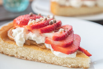 A beautiful dessert of sponge cake and cream with strawberries