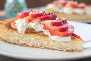A beautiful dessert of sponge cake and cream with strawberries