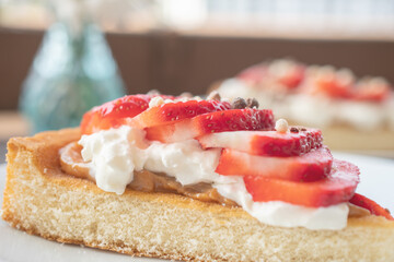 A beautiful dessert of sponge cake and cream with strawberries