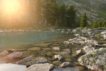 Idealistic photo of transparency and steadfastness. Theme of pure, clarity, calmness and peace in Zen Buddhism. Concept of sustainability of the universe. Landscape with stones and water