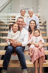 Kids portrait, happy family and parents with grandparents on stairs, smile at birthday celebration and love in house together. Elderly grandmother and man with children on steps to celebrate holiday