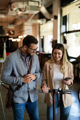 Business people in office talking. Beautiful businesswoman talking with colleagues..
